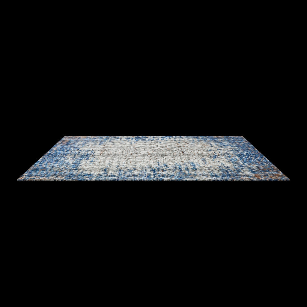 Detail of blue and rust pile at a fold, wave lines running across grey toward a blue edge.