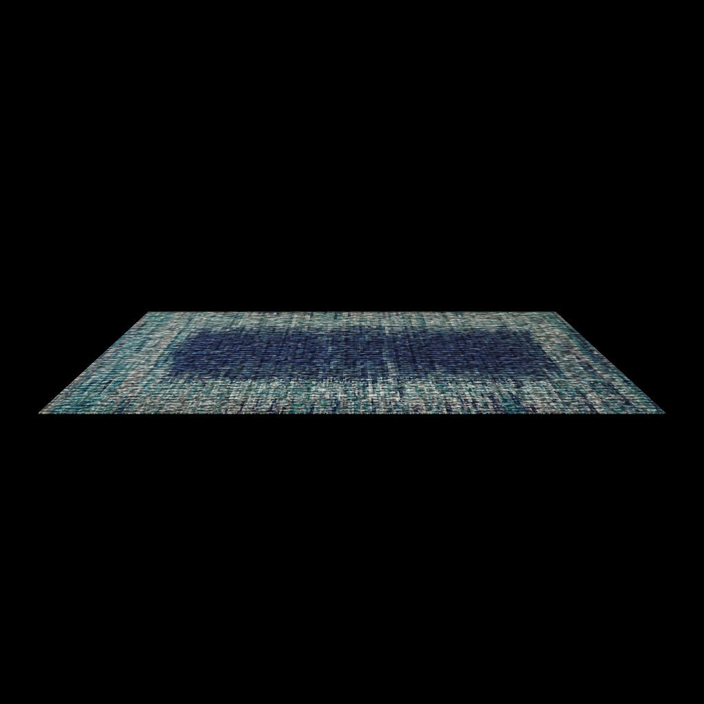 Teal and navy rug shown at an angle on a plain white background with no surrounding room.